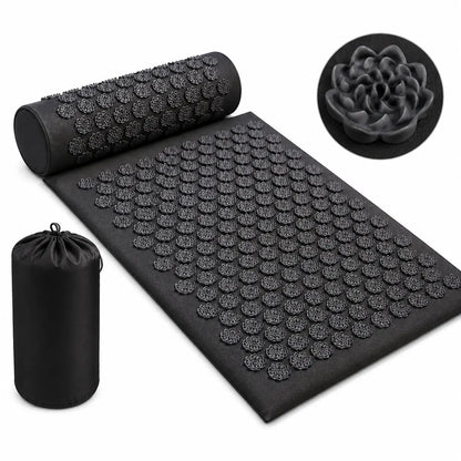 Black acupressure recovery mat set with matching pillow and carry bag displayed on a plain white background, featuring lotus-shaped pressure points designed for relaxation, stress relief, and muscle recovery.