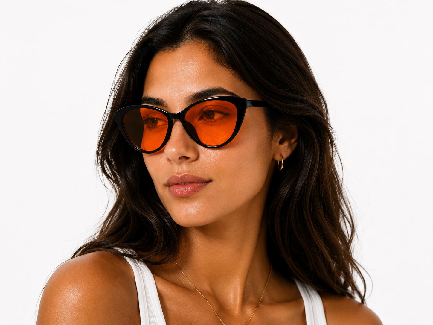 Model wearing Deep Drift cat eye blue light blocking sleep glasses with orange lenses and black frame for evening screen use and night time routines