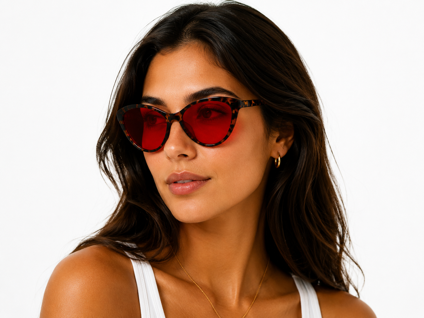 Model wearing Deep Drift cat eye blue light blocking sleep glasses with red lenses and tortoiseshell frame for evening screen use and night time routines