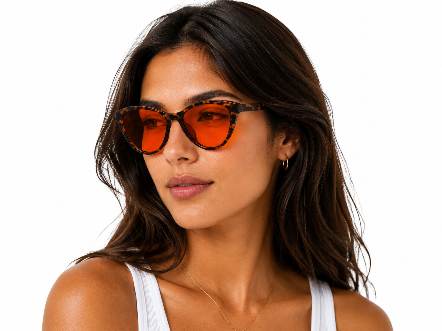 Model wearing Deep Drift cat eye blue light blocking sleep glasses with orange lenses and tortoiseshell frame for evening screen use and night time routines