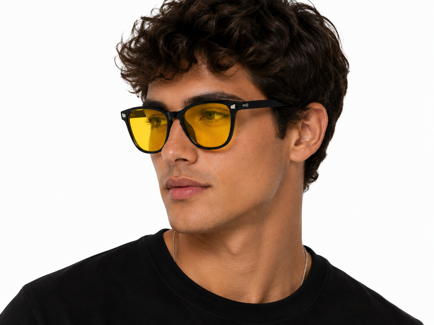 Male model wearing Deep Drift Honey Glow blue light blocking sleep glasses with yellow lenses designed to reduce eye strain and support better sleep