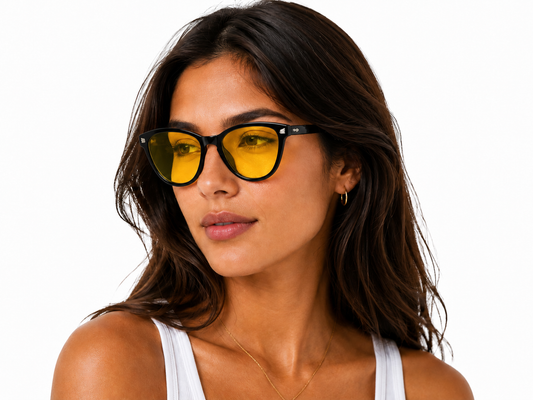 Model wearing Deep Drift Honey Glow blue light blocking sleep glasses designed to reduce eye strain and support better sleep