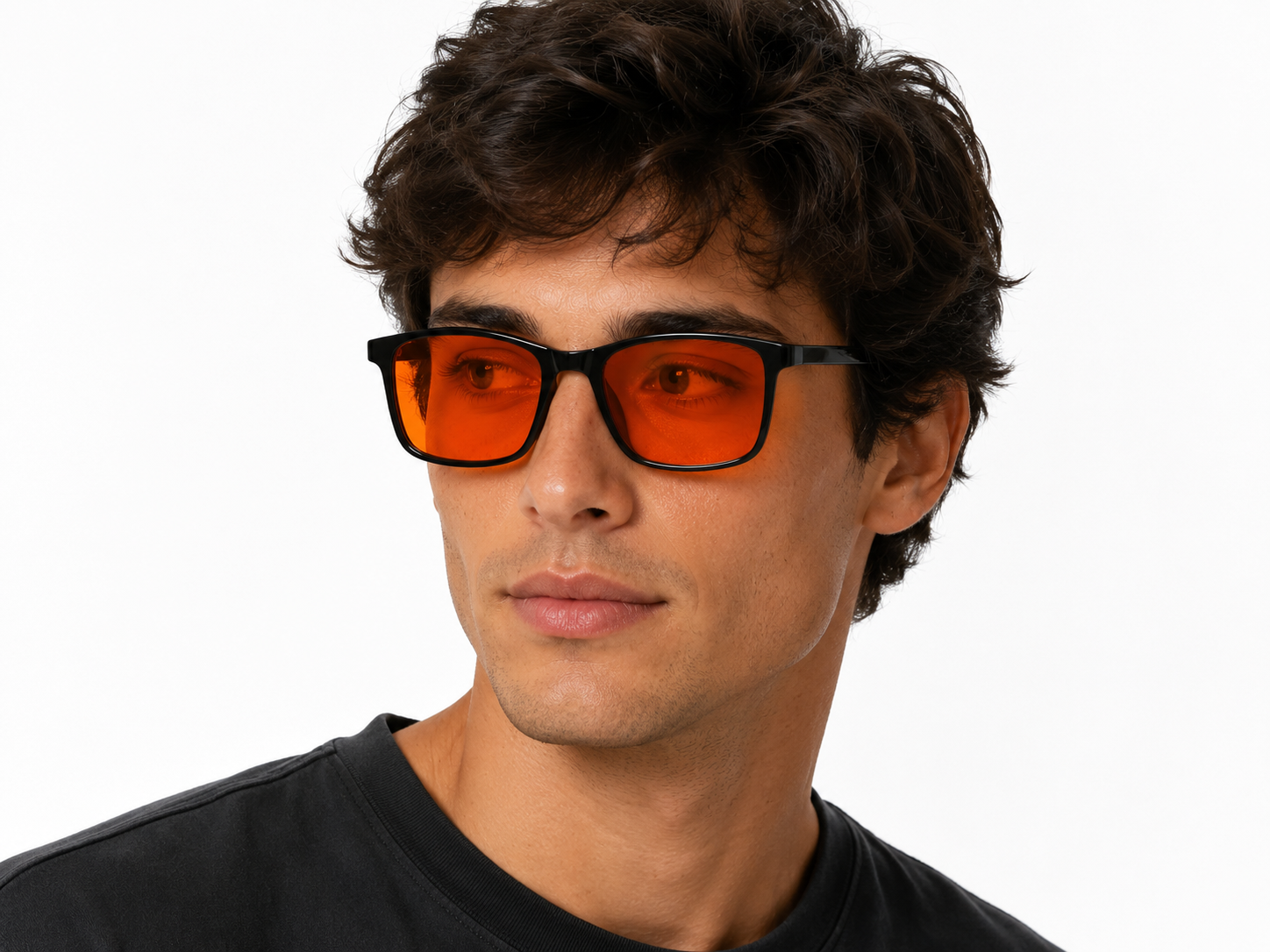 Man wearing Deep Drift Solar Dusk blue light sleep glasses with amber lenses for evening screen use and night-time comfort