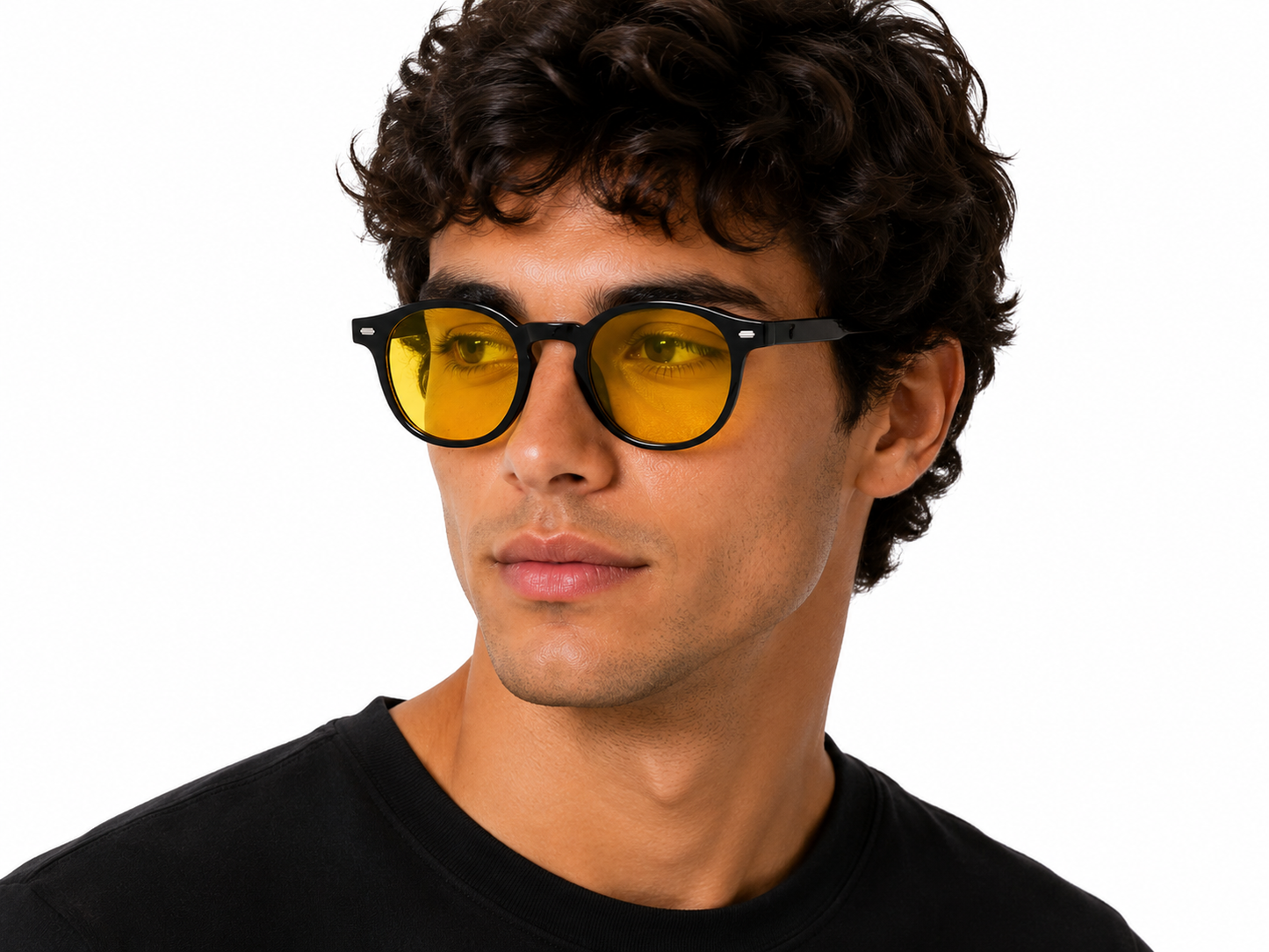 Male model wearing Deep Drift yellow blue light blocking sleep glasses with black round frames